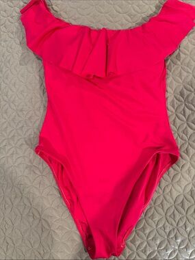 One-Piece soft stretchy swimsuit with ruffle accent. Off or on the shoulder.
